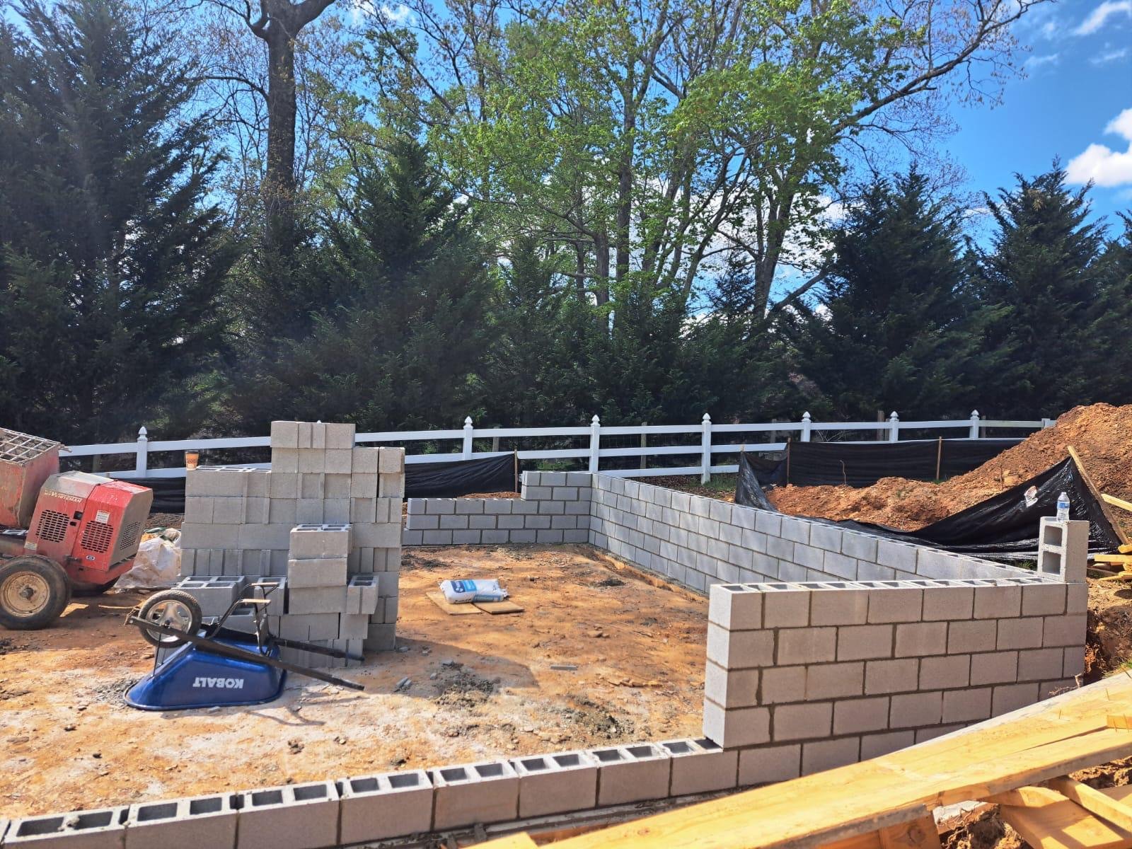 Structural Stone Retaining Wall #27 completed by New Style Masonry LLC in Hendersonville, NC